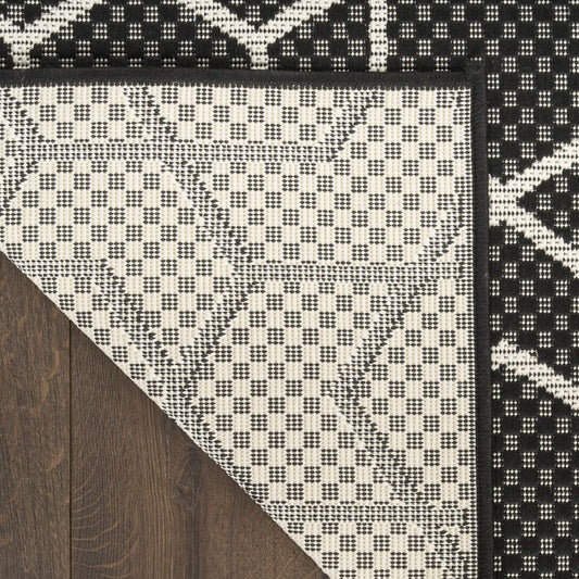Nourison The Horizon Outdoor Rug Collection featuring a geometric pattern in black and white