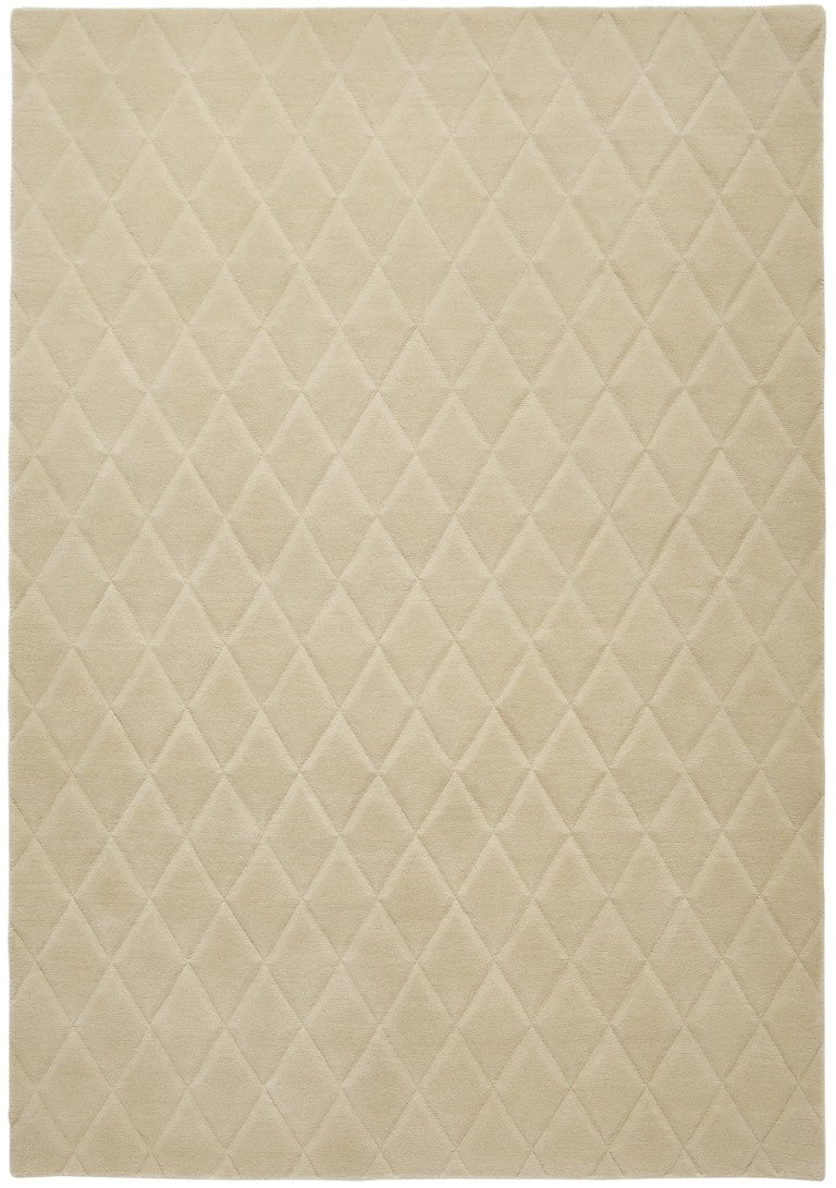 Luxury beige rug from The Priory Wool Collection with a diamond quilted pattern for elegant decor
