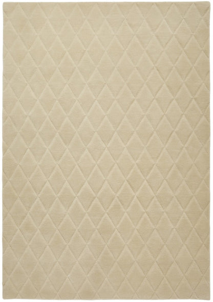 Luxury beige rug from The Priory Wool Collection with a diamond quilted pattern for elegant decor