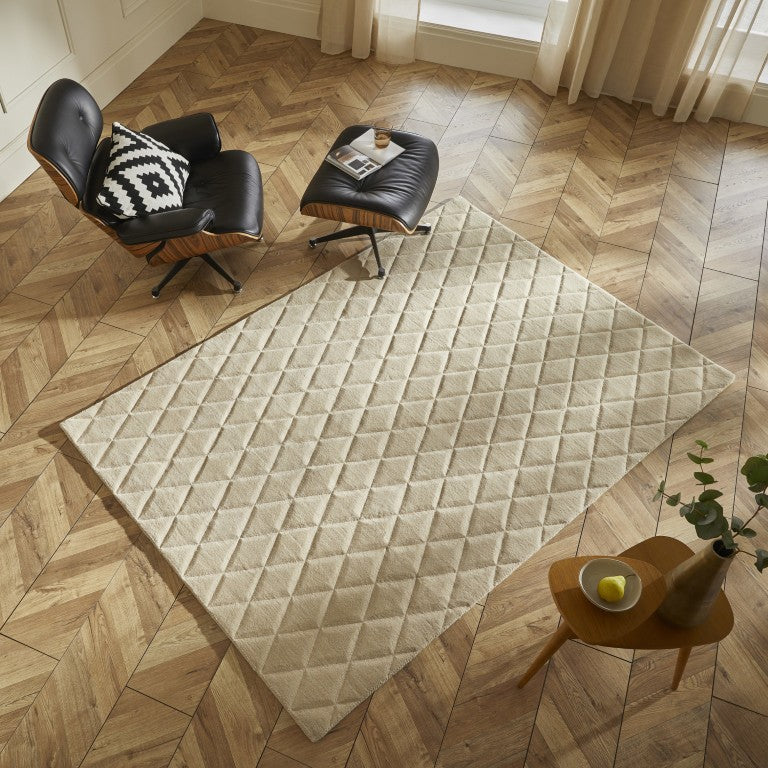Luxury rug from The Priory Wool Collection, featuring a diamond pattern on a light background