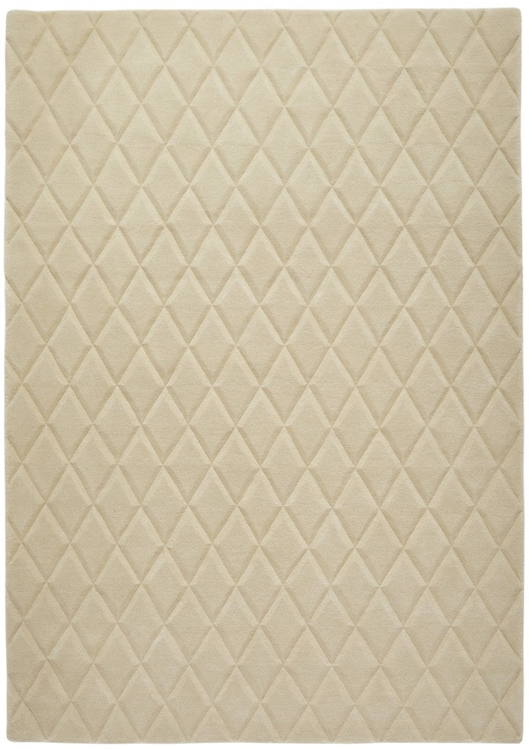 Luxury rug from The Priory Wool Collection featuring a diamond quilted pattern in soft beige