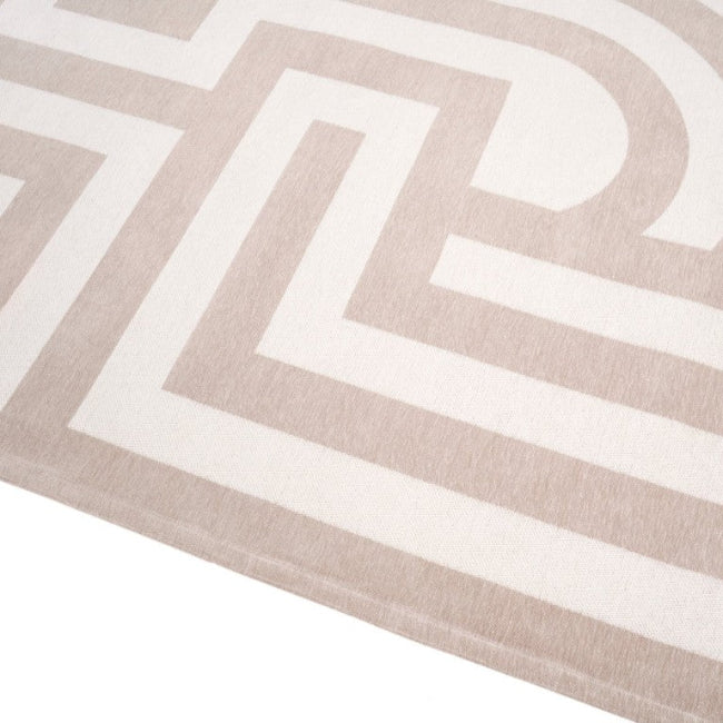 Close-up of a beige and white geometric patterned rug