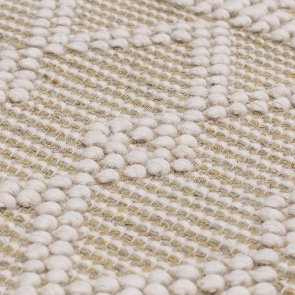 Close-up of textured cream and beige Boho Collection Asra Rug from Asiatic with raised woven pattern