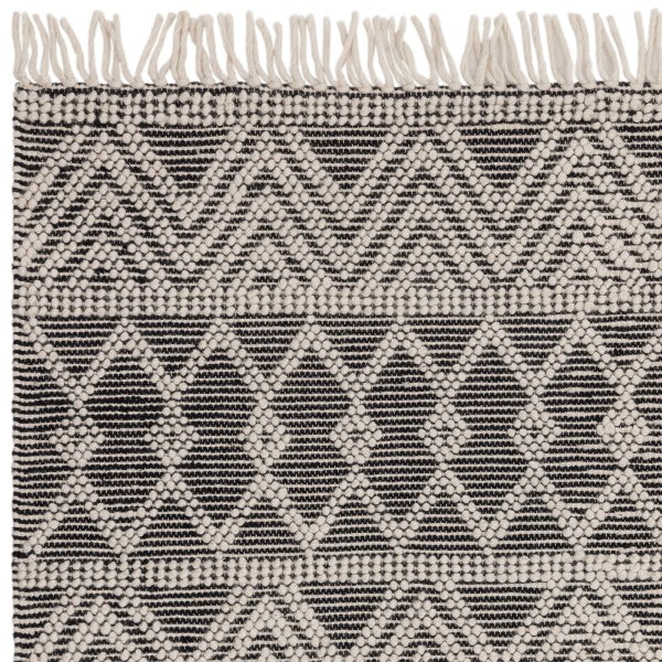 Boho Collection Asra Rug by Asiatic featuring black and white geometric patterns with textured weave and fringed edges