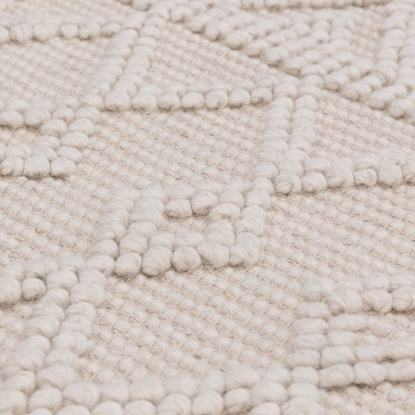 Close-up of textured cream luxury rug from Asiatic Boho Collection Asra Rug with geometric pattern