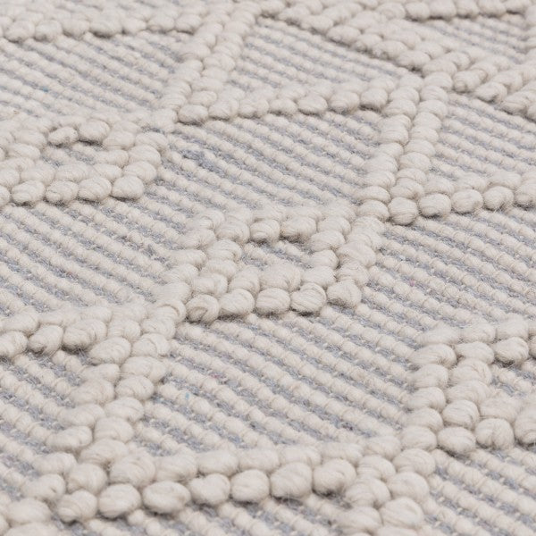 Close-up of Asiatic luxury Boho Collection Asra Rug with textured geometric patterns in neutral tones