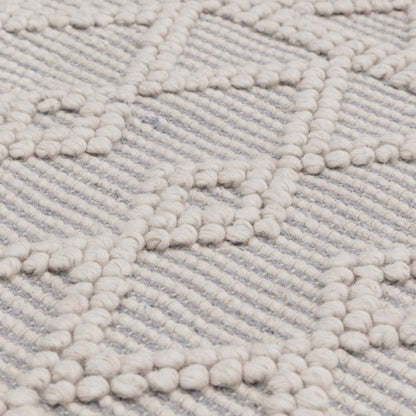 Close-up of Asiatic luxury Boho Collection Asra Rug with textured geometric patterns in neutral tones