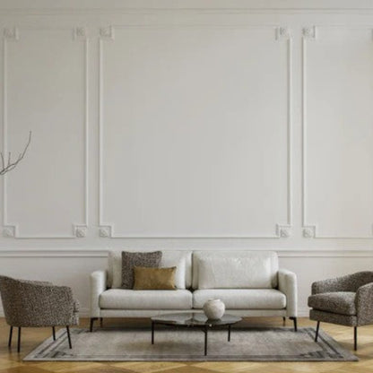 Modern living room with a white sofa, two armchairs, and a coffee table.