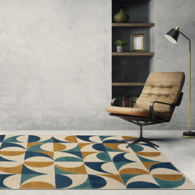 Geometric patterned rug in a room with a chair, lamp, and plant.